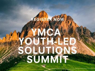 Image of a rocky mountain with green grass at the bottom